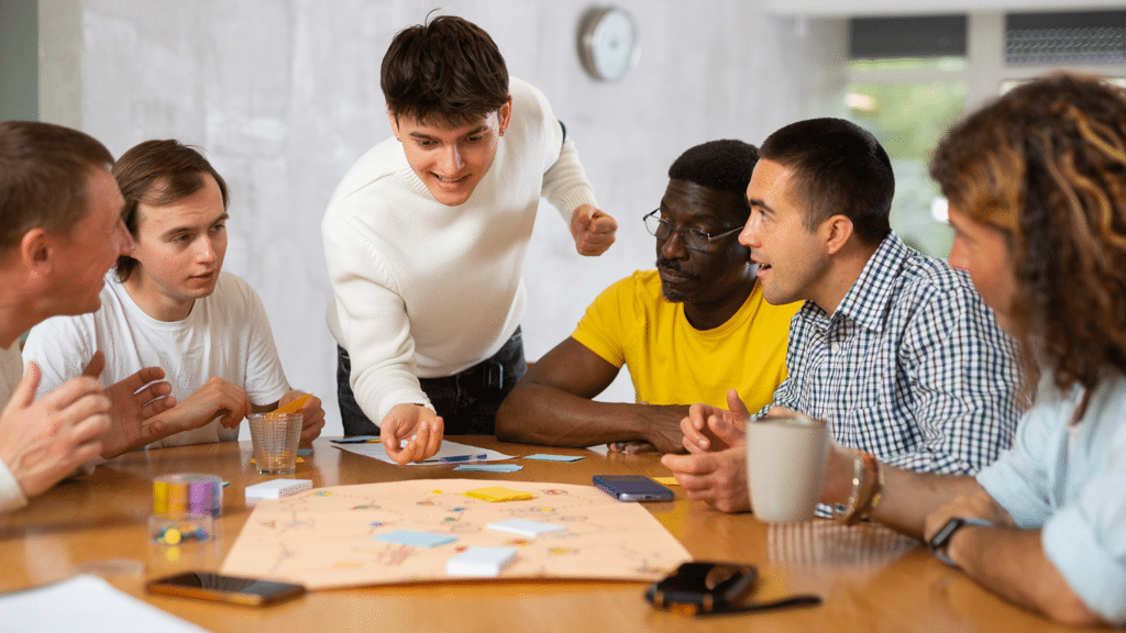 group of people playing a board game protorype